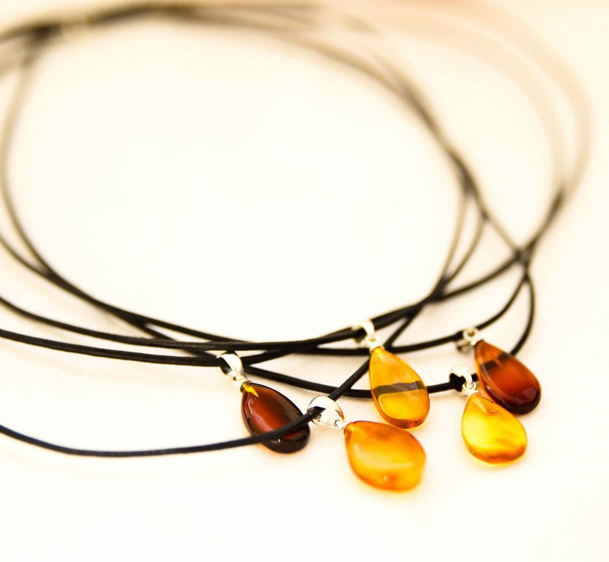 A beautiful leather adult health necklace with Baltic amber pear drop